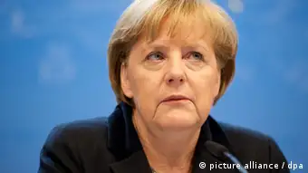 Die deutsche Bundeskanzlerin Angela Merkel trägt auf der nationalen Pressekonferenz die Ergebnisse des EU-Gipfels in Brüssel vor. Brüssel, 23.11.2012. Foto: Felix Kindermann