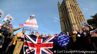 United Kingdom Independence Party (UKIP) supporters hold Union Jack flags and placards as they take part in a demonstration outside the Houses of Parliament in central London (Photo: CARL COURT/AFP/Getty Images)