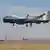  The Triton unmanned aircraft system is shown completing its first flight from the Northrop Grumman manufacturing facility in Palmdale, California