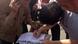 Photo title: A youngman signs "tamarod's" form Photo title: A youngman signs "tamarod's" form