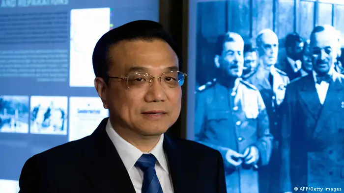 GettyImages 169504500 China's Prime Minister Li Keqiang stands next to a picture of the Potsdamer Treaty with Stalin and Harry Truman at the historic memorial place Celcilienhof in Potsdam, eastern Germany on May 26, 2013. The new premier's three-day visit to Germany, by far China's biggest European trading partner, indicates Beijing's wish to continue its special partnership with Europe's biggest economy, analysts say. AFP PHOTO /POOL/ SOEREN STACHE (Photo credit should read SOEREN STACHE/AFP/Getty Images)