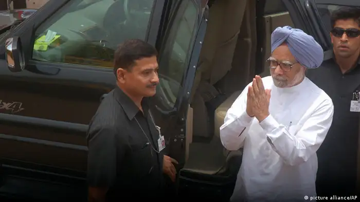 Indian Prime Minister Manmohan Singh, blue turban, arrives to attend a meeting to condole the death of victims of Saturday's Maoist attack at the Congress party office in Raipur, Chhattisgarh state, India, Sunday, May 26, 2013. Officials reacted with outrage Sunday to an audacious attack by about 200 suspected Maoist rebels who set off a roadside bomb and opened fire on a convoy carrying Indian ruling Congress party leaders and members in an eastern state, killing at least 24 people and wounding 37 others. (AP Photo)
