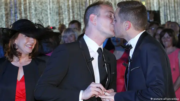 Vincent Autin kisses his partner Bruno Boileau during their marriage in Montpellier, southern France, 29 May 2013. (EPA/GUILLAUME HORCAJUELO)