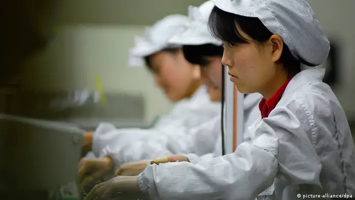 epa03166368 (FILE) A file photo dated 26 May 2010 of women workers laboring in a Foxconn factory in Shenzhen in south China's Guangdong province. Apple Inc and its manufacturing partner Foxconn agreed on 29 March 2012 to improve wages and working conditions at the Chinese factories accused of being sweatshops. A one-month investigation by the US-based Fair Labor Association pointed to 'significant issues' with working conditions at three Foxconn plants in southern China, the group said in a report released Thursday in Washington. The association said it recommended a series of improvements after questioning 35,000 workers and finding excessive overtime, payment problems, and several health and safety risks. EPA/Wang Lei