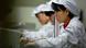 Foxconn-Arbeiter in China. (Foto: Wang Lei/epa) Foxconn-Arbeiter in China. (Foto: Wang Lei/epa)
