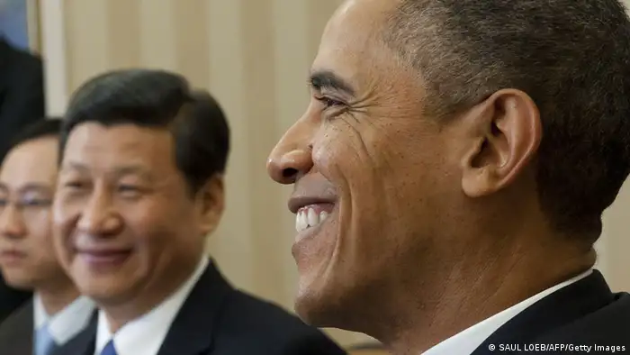 US President Barack Obama speaks alongside Chinese Vice President Xi Jinping (C) during meetings in the Oval Office of the White House in Washington, DC, February 14, 2012. Obama received the 58-year-old Chinese leader-in-waiting in the Oval Office, following Xi's meetings earlier in the day at the White House with Vice President Joe Biden and Secretary of State Hillary Clinton. AFP PHOTO / Saul LOEB (Photo credit should read SAUL LOEB/AFP/Getty Images)
