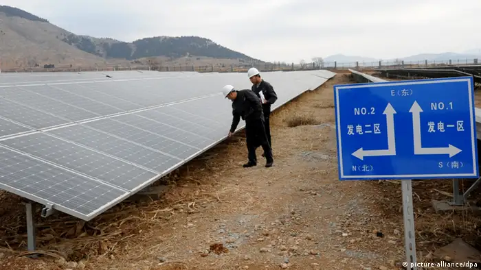 Chinese inspectors check arrays of solar panels at a photovoltaic power plant in Xiji town, Zaozhuang city, east Chinas Shandong province, 26 December 2012. China may almost double its upper limit for solar power installed capacity to 40 gigawatts (GW) by 2015 from the current 21 GW, an industry insider said. Solar cell plants face tough prospects after the United States and Europe launched anti-dumping measures on Chinese solar power products in November. Some high-ranking government officials have organized closed-door meetings for photovoltaic (PV) energy plants to discuss their situation, according to Meng Xiangan, deputy Board Chairman of the Chinese Renewable Energy Society (CRES). According to a report released by the National Energy Administration (NEA) on September 12, China will expand its installed solar power generation capacity to 21 GW, or 21 million kilowatts, by 2015. This is a five-fold increase from the 3.6 million kilowatts seen at the end of 2011.