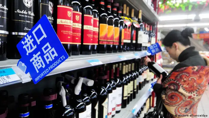 --File--A customer shops for imported wine at a supermarket in Fuzhou city, southeast Chinas Fujian province, 28 March 2011. Foreign wine imports are growing rapidly in China, as the nation has imported a record of US$1.27 billion of bottled wine in 2011, up 94 percent year-on year. However, the value of imported loose-packed wine was down 20 percent from the previous year to US$120 million, according to the statistics released at the first China Worldwide Wine Summit Forum. The sale of imported bottled wine first surpassed imported loose-packed wine in 2009, Xinhua news agency quoted Lin Feng, vice president of H & J Consulting Company. The sale of imported bottled wine doubled that of loose-packed wine in two years, indicating that the imported wine market is evolving from low-end to high-end, Lin said during the forum held in Hefei, capital of Anhui Province. According to statistics provided by the China Culture Association of Poetry and Wine (CCAPW), also the sponsor of the forum, the total volume of imported wine increased 76.5 percent and 80.9 percent in 2010 and 2011 respectively.