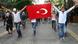 Anti-government protesters hold up a Turkish flag as they demonstrate in the center of Ankara, Turkey on June 6, 2013. Turkish Prime Minister Recep Tayyip Erdogan said on June 6 that members of a 'terrorist organisation' were taking part in deadly anti-government protests sweeping Turkey and refused to cancel a controversial Istanbul development plan that sparked them. Protesters accuse Erdogan of imposing conservative Islamic reforms on Turkey, a mostly Muslim but constitutionally secular country. AFP PHOTO / ADEM ALTAN (Photo credit should read ADEM ALTAN/AFP/Getty Images) Anti-government protesters hold up a Turkish flag as they demonstrate in the center of Ankara, Turkey on June 6, 2013. Turkish Prime Minister Recep Tayyip Erdogan said on June 6 that members of a 'terrorist organisation' were taking part in deadly anti-government protests sweeping Turkey and refused to cancel a controversial Istanbul development plan that sparked them. Protesters accuse Erdogan of imposing conservative Islamic reforms on Turkey, a mostly Muslim but constitutionally secular country. AFP PHOTO / ADEM ALTAN (Photo credit should read ADEM ALTAN/AFP/Getty Images)
