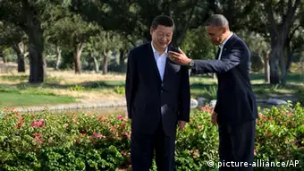 President Barack Obama gestures with Chinese President Xi Jinping at the Annenberg Retreat at Sunnylands as they meet for talks Friday, June 7, 2013, in Rancho Mirage, Calif. Seeking a fresh start to a complex relationship, the two leaders are retreating to the sprawling desert estate for two days of talks on high-stakes issues, including cybersecurity and North Korea's nuclear threats. (AP Photo/Evan Vucci)