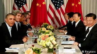 U.S. President Barack Obama (L) and Chinese President Xi Jinping (2nd R) meet at The Annenberg Retreat at Sunnylands in Rancho Mirage, California June 8, 2013. The two-day talks at a desert retreat near Palm Springs, California, was meant to be an opportunity for Obama and Xi to get to know each other, Chinese and U.S. officials have said, and to inject some warmth into often chilly relations while setting the stage for better cooperation.