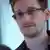 U.S. National Security Agency whistleblower Edward Snowden, an analyst with a U.S. defence contractor, is seen in this still image taken from a video during an interview with the Guardian in his hotel room in Hong Kong June 6, 2013. The 29-year-old contractor at the NSA revealed top secret U.S. surveillance programmes to alert the public of what is being done in their name, the Guardian newspaper reported on Sunday. Snowden, a former CIA technical assistant who was working at the super-secret NSA as an employee of defence contractor Booz Allen Hamilton, is ensconced in a hotel in Hong Kong after leaving the United States with secret documents. Footage taken June 6, 2013. REUTERS/Ewen MacAskill/The Guardian/Handout (CHINA - Tags: POLITICS MEDIA) ATTENTION EDITORS - THIS IMAGE WAS PROVIDED BY A THIRD PARTY. FOR EDITORIAL USE ONLY. NOT FOR SALE FOR MARKETING OR ADVERTISING CAMPAIGNS. THIS PICTURE IS DISTRIBUTED EXACTLY AS RECEIVED BY REUTERS, AS A SERVICE TO CLIENTS. NO SALES. NO ARCHIVES. THIS PICTURE IS DISTRIBUTED EXACTLY AS RECEIVED BY REUTERS, AS A SERVICE TO CLIENTS. MANDATORY CREDIT