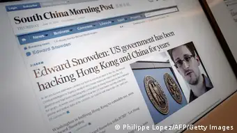 Screens show an edition of the South China Morning Post carrying the story of former US spy Edward Snowden (lower R) at the newspaper's offices in Hong Kong on June 13, 2013. Snowden broke his silence in an interview to the South China Morning Post on June 12, vowing to fight any bid to extradite him from Hong Kong and accusing Washington's cyber-troops of prying into hundreds of thousands of targets globally including many in China. AFP PHOTO / Philippe Lopez (Photo credit should read PHILIPPE LOPEZ/AFP/Getty Images)