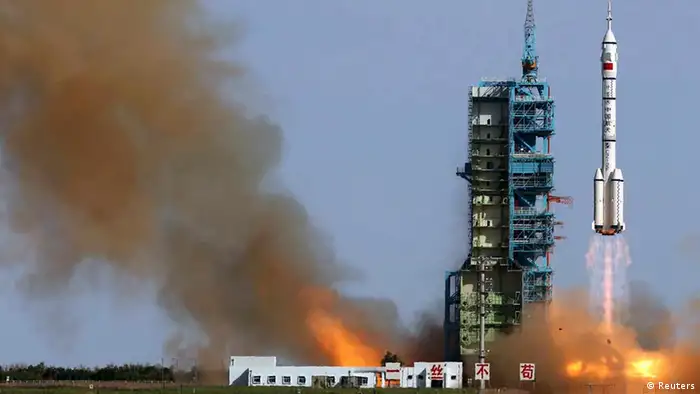 The Long March 2-F rocket loaded with Shenzhou-10 manned spacecraft carrying Chinese astronauts Nie Haisheng, Zhang Xiaoguang and Wang Yaping lifts off from the launch pad in the Jiuquan Satellite Launch Center, Gansu province June 11, 2013. REUTERS/China Daily (CHINA - Tags: SCIENCE TECHNOLOGY POLITICS) CHINA OUT. NO COMMERCIAL OR EDITORIAL SALES IN CHINA