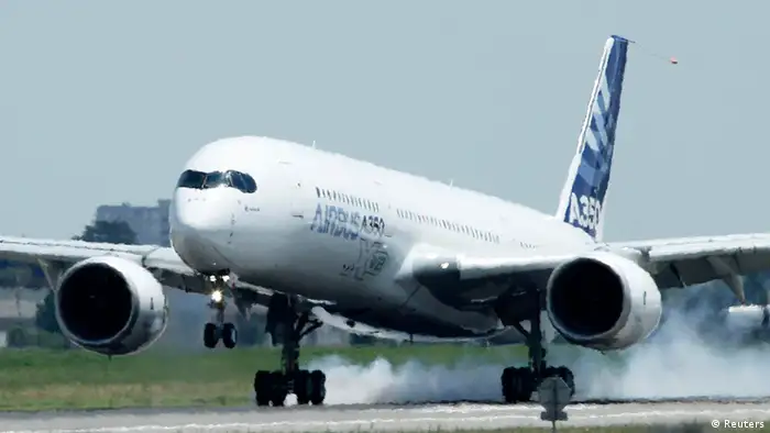 The new Airbus A350 lands at Toulouse-Blagnac airport after its maiden flight in southwestern France, June 14, 2013. Europe's newest passenger jet, the Airbus A350, successfully began its maiden flight on Friday. Watched by over 10,000 employees and spectators, the sleek jet with curled wingtips took off from Airbus's Toulouse plant under cloudy skies, with a crew of six wearing parachutes and orange jumpsuits and with tonnes of test equipment on board. REUTERS/Jean-Philippe Arles (FRANCE - Tags: TRANSPORT BUSINESS)