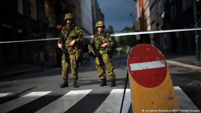 Norwegian soldiers stands guard on July 23, 2011 few blocks from the government headquarters, the site of the July 22 bomb attack in Oslo. Police said they were questioning a Christian fundamentalist today over twin attacks on a youth camp and the government headquarters that killed 92 people in Norway's deadliest post-war tragedy. AFP PHOTO / JONATHAN NACKSTRAND (Photo credit should read JONATHAN NACKSTRAND/AFP/Getty Images)
