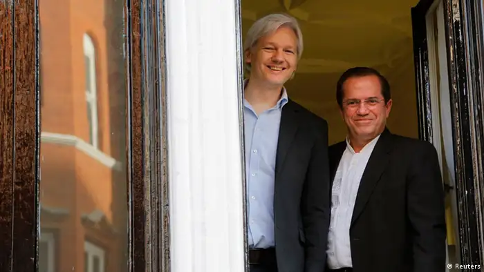 WikiLeaks founder Julian Assange stands with Ecuador's Foreign Affairs Minister Ricardo Patino (R) at Ecuador's embassy in central London June 16, 2013. Assange sought asylum in the embassy on June 19, 2012, in an attempt to avoid extradition to Sweden. REUTERS/Chris Helgren (BRITAIN - Tags: POLITICS MEDIA CRIME LAW)