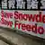 A poster supporting Edward Snowden, a former contractor at the National Security Agency (NSA) who leaked revelations of U.S. electronic surveillance, is displayed at Hong Kong's financial central district June 17, 2013. Snowden reportedly flew to Hong Kong on May 20. He checked out of a luxury hotel on June 10 and his whereabouts remain unknown. Snowden has said he intends to stay in Hong Kong to fight any potential U.S. moves to extradite him. REUTERS/Bobby Yip (CHINA - Tags: POLITICS CRIME LAW SCIENCE TECHNOLOGY)