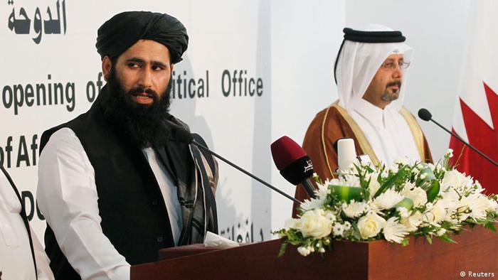 Muhammad Naeem (L), a spokesman for the Office of the Taliban of Afghanistan speaks during the opening of the Taliban Afghanistan Political Office in Doha June 18, 2013. The Afghan Taliban opened an office in Qatar on Tuesday to help restart talks on ending the 12-year-old war, saying it wanted a political solution that would bring about a just government and end foreign occupation. Taliban representative Mohammed Naeem told a news conference at the office in the capital Doha that the Islamist insurgency wanted good relations with Afghanistan's neighbouring countries. REUTERS/Mohammed Dabbous (QATAR - Tags: POLITICS)