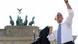 U.S. President Barack Obama waves after giving a speech in front of the Brandenburg Gate in Berlin June 19, 2013. Obama's first presidential visit to Berlin comes nearly 50 years to the day after John F. Kennedy landed in a divided Berlin at the height of the Cold War and told encircled westerners in the city "Ich bin ein Berliner", a powerful signal that America would stand by them. REUTERS/MichaelKappeler/Pool (GERMANY - Tags: POLITICS ) U.S. President Barack Obama waves after giving a speech in front of the Brandenburg Gate in Berlin June 19, 2013. Obama's first presidential visit to Berlin comes nearly 50 years to the day after John F. Kennedy landed in a divided Berlin at the height of the Cold War and told encircled westerners in the city "Ich bin ein Berliner", a powerful signal that America would stand by them. REUTERS/MichaelKappeler/Pool (GERMANY - Tags: POLITICS )