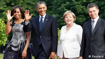 U.S. President Barack Obama arrives for dinner with his wife U.S. first lady Michelle Obama (L) German Chancellor Angela Merkel (2nd R) and her husband Joachim Sauer (R) at Charlottenburg Castle in Berlin June 19, 2013. Obama offered a new twist on Wednesday to John F. Kennedy's historic 1963 call for liberty -- Ich bin ein Berliner -- by saying other oppressed people eager to join the free world were also citizens of Berlin. REUTERS/Tobias Schwarz (GERMANY - Tags: POLITICS)
