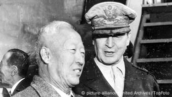 South Korean President's appeal to Macarthur brings U.S. Aid to invaded Country. Syngman Rhee, President of South Korea photographed with General MacArthur. 28 June 1950 Korea / Mono Negative