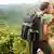 #53248696 - Couple in love kissing while hiking on Hawaii © Maridav