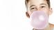 A boy blowing a bubble with chewing gum, Copyright: Fotolia A boy blowing a bubble with chewing gum, Copyright: Fotolia