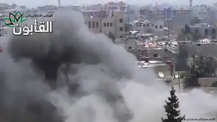 This image made from amateur video released by Ugarit News, which has been authenticated based on its contents and other AP reporting, shows smoke rises in Damascus, Syria, Friday, June 21, 2013. The commander of Syria's rebels confirms they have received new weapons, giving his forces more power in battles against government troops and Hezbollah fighters from Lebanon. Gen. Salim Idris refused to say in an interview with Al-Jazeera TV Friday where the weapons came from. (AP Photo/Ugarit News via AP video)