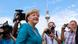 German Chancellor and leader of the Christian Democratic Union (CDU) Angela Merkel (C) arrives for a party meeting with the Christian Social Union (CSU) in Berlin June 23, 2013. The building in the background is the television tower. REUTERS/Tobias Schwarz (GERMANY - Tags: POLITICS) German Chancellor and leader of the Christian Democratic Union (CDU) Angela Merkel (C) arrives for a party meeting with the Christian Social Union (CSU) in Berlin June 23, 2013. The building in the background is the television tower. REUTERS/Tobias Schwarz (GERMANY - Tags: POLITICS)