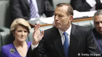 CANBERRA, AUSTRALIA - JUNE 26: Opposition leader Tony Abbott gestures during question time at Parliament House on June 26, 2013 in Canberra, Australia. It has been reported Rudd supporters are circulating a petition for a special caucus meeting for a ballot on the Labor leadership. Should they receive the required 35 signatures, a vote would be held at 9am tomorrow morning. Should they receive the required 35 signatures, a vote would be held at 9am tomorrow morning. (Photo by Stefan Postles/Getty Images)