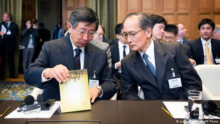 Japanese Deputy Minister of Foreign Affairs Koji Tsuruoka, left, and Ambassador of Japan to the Netherlands Yasumasa Nagamine await the start of the case at the International Court of Justice (ICJ) in The Hague, Netherlands, Wednesday, June 26, 2013. Australia is urging the United Nations' highest court to ban Japan's annual whale hunt. (Photo: AP)