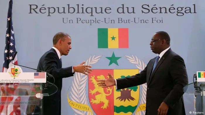 U.S. President Barack Obama (L) and Senegal President Macky Sall shake hands after their joint news conference at the Presidential Palace June 27, 2013 in Dakar, Sengal. Obama's trip, his second to the continent as president, will take him to Senegal, South Africa and Tanzania. REUTERS/Gary Cameron (SENEGAL - Tags: POLITICS)