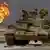 ARCHIV - Das Wrack eines verlassenen irakischen Panzers vom Typ T-62 sowjetischer Bauart steht am 02.04.1991 am Rande einer Wüstenstraße in Kuwait während im Hintergrund ein brennendes Bohrloch des Al-Ahmadi Ölfeldes zu sehen ist (Archivfoto). Vor 20 Jahren begann in der Nacht zum 17. Januar 1991 der Golfkrieg zur Befreiung Kuwaits. Der irakische Diktator Saddam Hussein hatte das von ihm angedrohte «brennende Kuwait» wahr gemacht und ließ mehr als 700 Ölquellen anzünden. Die letzte wurde erst knapp zehn Monate später am 6. November gelöscht. Foto: Pascal Guyot AFP/dpa (zu dpa Themenpaket zum 20. Jahrestag des Golfkriegs zur Befreiung Kuwaits (Beginn in der Nacht zum 17. Januar 1991) +++(c) dpa - Bildfunk+++