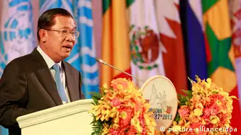 epa03747659 Cambodian Prime Minister Hun Sen speaks during the opening ceremony of the 37th session of the World Heritage Committee, Phnom Penh, Cambodia, 16 June 2013. Cambodia is hosting the 37th session of the World Heritage Committee from 16 to 27 June 2013. EPA/MAK REMISSA