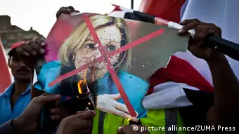 June 28, 2013 - Cairo, Egypt - A photograph of U.S. Ambassador to Egypt Anne Patterson is burned outside the Ministry of Defense in Cairo on Friday. Supporters and opponents of Egyptian President Mohammed Morsi have staged rival rallies across the country ahead of a Sunday protest planned by the opposition with thousands of Morsi supporters rallied outside the main mosque in Cairo's Nasr district. At least one person, said by state TV to be a US journalist, was killed in Alexandria as protesters stormed a local Muslim Brotherhood office
