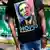 A man wears a t-shirt with a Barack Obama portrait