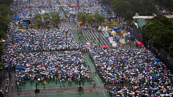 Thousands of pro-democracy protesters gather to march in the streets to demand universal suffrage and urge Hong Kong's Chief Executive Leung Chun-ying to step down in Hong Kong July 1, 2013. Monday marked the 16th anniversary of the territory's handover to China from Britain. REUTERS/Tyrone Siu (CHINA - Tags: POLITICS CIVIL UNREST ANNIVERSARY)