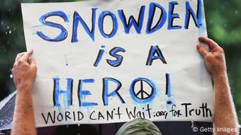 GettyImages 170293810 NEW YORK, NY - JUNE 10: A supporter holds a sign at a small rally in support of National Security Administration (NSA) whistleblower Edward Snowden in Manhattan's Union Square on June 10, 2013 in New York City. About 15 supporters attended the rally a day after Snowden's identity was revealed in the leak of the existence of NSA data mining operations. (Photo by Mario Tama/Getty Images)