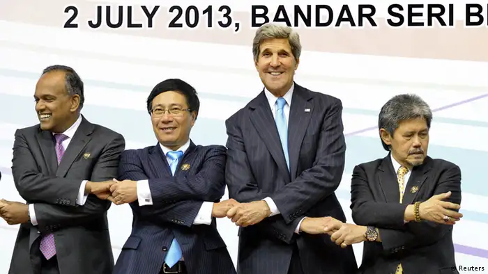 US Secretary of State John Kerry (2nd R) with ASEAN counterparts Singapore's Foreign Minister K Shanmugam (L), Vietnamese Foreign Minister Pham Binh Minh (2nd L) and Bruneian Foreign Minister Mohammad Bolkiah (R) shake hands during a group photogrpah at the 3rd East Asia Summit (EAS) Foreign Minister's Meeting in Brunei's capital Bandar Seri Begawan on July 2, 2013. US Secretary of State John Kerry meets his Russian counterpart Sergei Lavrov on July 2 in Brunei in hopes of narrowing differences on ending the Syrian bloodshed, a task complicated by the two powers' tug-of-war over fugitive US secrets leaker Edward Snowden. AFP PHOTO / ROSLAN RAHMAN (Photo credit should read ROSLAN RAHMAN/AFP/Getty Images)