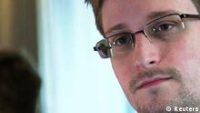 NSA whistleblower Edward Snowden, an analyst with a U.S. defence contractor, is seen in this still image taken from video during an interview by The Guardian in his hotel room in Hong Kong June 6, 2013. Former U.S. spy agency contractor Snowden has applied for political asylum in Russia, a Russian immigration source close to the matter said on July 1, 2013. Picture taken June 6, 2013. REUTERS/Glenn Greenwald/Laura Poitras/Courtesy of The Guardian/Handout via Reuters (CHINA - Tags: POLITICS MEDIA) ATTENTION EDITORS - THIS IMAGE WAS PROVIDED BY A THIRD PARTY. FOR EDITORIAL USE ONLY. NOT FOR SALE FOR MARKETING OR ADVERTISING CAMPAIGNS. NO SALES. NO ARCHIVES. THIS PICTURE WAS PROCESSED BY REUTERS TO ENHANCE QUALITY. NO THIRD PARTY SALES. NOT FOR USE BY REUTERS THIRD PARTY DISTRIBUTORS. MANDATORY CREDIT