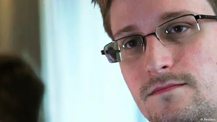 NSA whistleblower Edward Snowden, an analyst with a U.S. defence contractor, is seen in this still image taken from video during an interview by The Guardian in his hotel room in Hong Kong June 6, 2013. Former U.S. spy agency contractor Snowden has applied for political asylum in Russia, a Russian immigration source close to the matter said on July 1, 2013. Picture taken June 6, 2013. REUTERS/Glenn Greenwald/Laura Poitras/Courtesy of The Guardian/Handout via Reuters (CHINA - Tags: POLITICS MEDIA) ATTENTION EDITORS - THIS IMAGE WAS PROVIDED BY A THIRD PARTY. FOR EDITORIAL USE ONLY. NOT FOR SALE FOR MARKETING OR ADVERTISING CAMPAIGNS. NO SALES. NO ARCHIVES. THIS PICTURE WAS PROCESSED BY REUTERS TO ENHANCE QUALITY. NO THIRD PARTY SALES. NOT FOR USE BY REUTERS THIRD PARTY DISTRIBUTORS. MANDATORY CREDIT