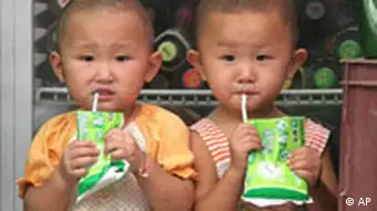 Two Chinese children drink breakfast milk at a store in Beijing Friday Aug. 26, 2005. Government statistics show that 117 boys are born in China for every 100 girls. Birth-control policies which limit many couples to only one child result in some female fetuses being aborted by parents who prefer boys. (AP Photo)