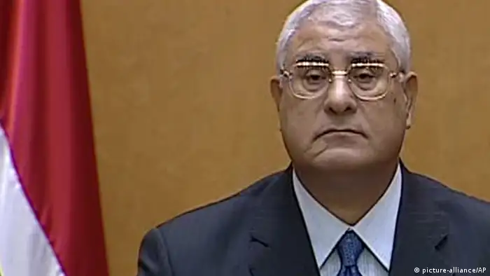 This image made from Egyptian State Television shows Egypt's interim president Adly Mansour speaking after being sworn in at the constitutional court in Cairo, Thursday, July 4, 2013. Egypt's chief justice of the Supreme Constitutional Court has been sworn in as interim president after Egyptians awoke Thursday to a new political reality after the military overthrew the country's first democratically elected president after only a year in office, shunting the Islamist leader aside in the same kind of Arab Spring uprising that brought him to power. (AP Photo/Egyptian State TV)