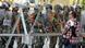 A protester who supports former Egyptian President Mohamed Mursi offers flowers to military personnel during clashes outside the Republican Guard building in Cairo July 5, 2013. At least three demonstrators were shot dead outside the Republican Guard barracks in Cairo where deposed Islamist President Mohamed Mursi is being held, security sources said. REUTERS/Louafi Larbi (EGYPT - Tags: POLITICS CIVIL UNREST) A protester who supports former Egyptian President Mohamed Mursi offers flowers to military personnel during clashes outside the Republican Guard building in Cairo July 5, 2013. At least three demonstrators were shot dead outside the Republican Guard barracks in Cairo where deposed Islamist President Mohamed Mursi is being held, security sources said. REUTERS/Louafi Larbi (EGYPT - Tags: POLITICS CIVIL UNREST)