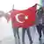 Protesters with a Turkish flag