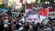 Supporters of ousted Egyptian President Mohamed Mursi chant slogans while carrying a big banner of Mursi in front of the Republican Guard headquarters as they camp for the third day in Cairo July 7, 2013. Thousands of supporters of Mursi protested outside his place of detention in Cairo on Sunday while a military-driven plan to resolve the political crisis remained mired in mistrust and confusion. REUTERS/Asmaa Waguih (EGYPT - Tags: POLITICS CIVIL UNREST MILITARY) Supporters of ousted Egyptian President Mohamed Mursi chant slogans while carrying a big banner of Mursi in front of the Republican Guard headquarters as they camp for the third day in Cairo July 7, 2013. Thousands of supporters of Mursi protested outside his place of detention in Cairo on Sunday while a military-driven plan to resolve the political crisis remained mired in mistrust and confusion. REUTERS/Asmaa Waguih (EGYPT - Tags: POLITICS CIVIL UNREST MILITARY)