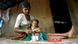 (FILES) Int his photograph taken on July 24, 2007, Indian tribal woman Hira Bai takes care of her grandchild Rohit in their mud and bamboo reinforced hut in Devipada, a tribal settlement in the remote forestland of Aarey Milk Colony on the outskirts of Mumbai. (Photo: PAL PILLAI/AFP/Getty Images) (FILES) Int his photograph taken on July 24, 2007, Indian tribal woman Hira Bai takes care of her grandchild Rohit in their mud and bamboo reinforced hut in Devipada, a tribal settlement in the remote forestland of Aarey Milk Colony on the outskirts of Mumbai. (Photo: PAL PILLAI/AFP/Getty Images)
