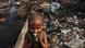 A young child standing in a slum (photo: DIBYANGSHU SARKAR/AFP/Getty Images) A young child standing in a slum (photo: DIBYANGSHU SARKAR/AFP/Getty Images)