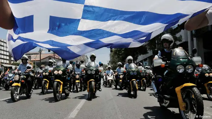 Municipal policemen march on their motorcycles during a rally by local government workers, against the public sector reforms and layoffs Greece has promised its international lenders, in Athens July 8, 2013. The euro zone must decide on Monday how to keep Greece on a lifeline but is divided over whether to delay aid payments to Athens to force through unpopular reforms ranging from sacking public workers to selling state assets. REUTERS/John Kolesidis (GREECE - Tags: CIVIL UNREST POLITICS BUSINESS TPX IMAGES OF THE DAY)